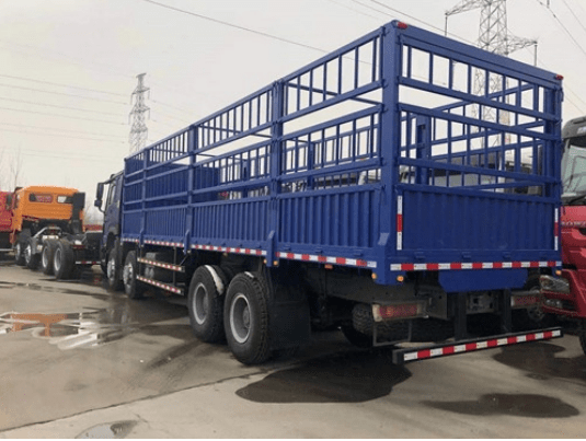 A blue-colored cargo truck