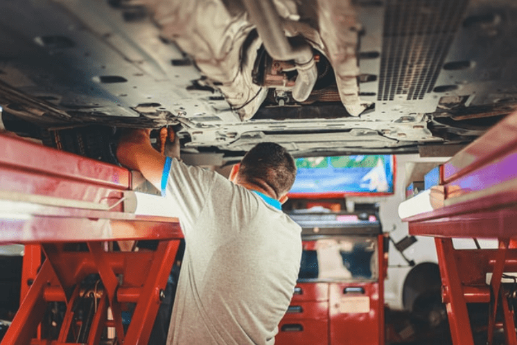 A mechanic repairing a truck