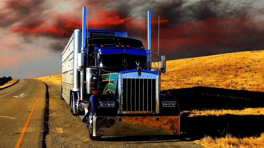 Heavy-duty blue truck in the countryside